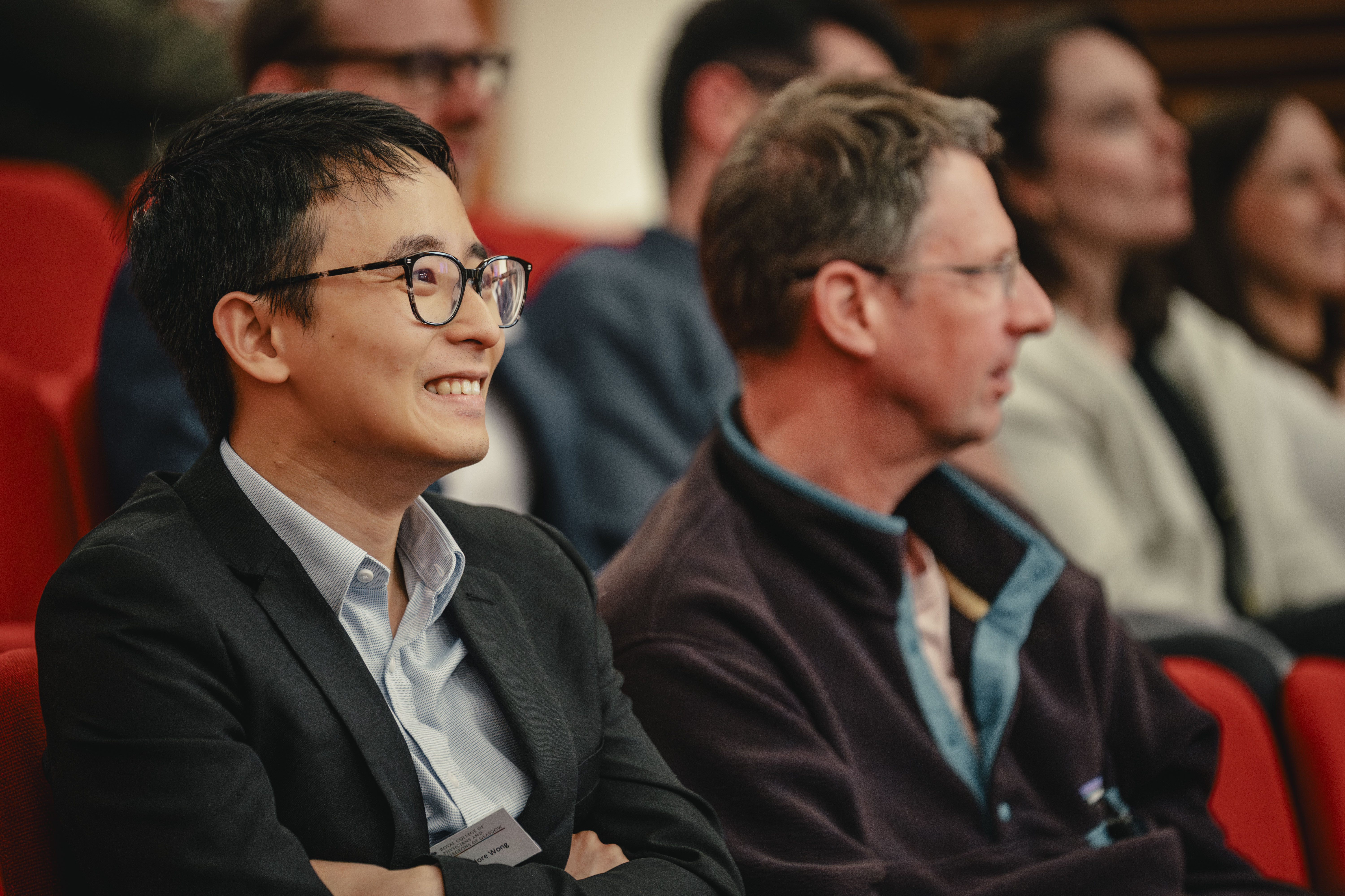 Person smiling during a lecture